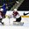 GRAND FORKS, NORTH DAKOTA - APRIL 15: LatviaÕs Mareks Mitens #30 looks to make a save while Sandis Smons #19 and Sweden's Oskar Steen #20 collide in front of the net during preliminary round action at the 2016 IIHF Ice Hockey U18 World Championship. (Photo by Matt Zambonin/HHOF-IIHF Images)

